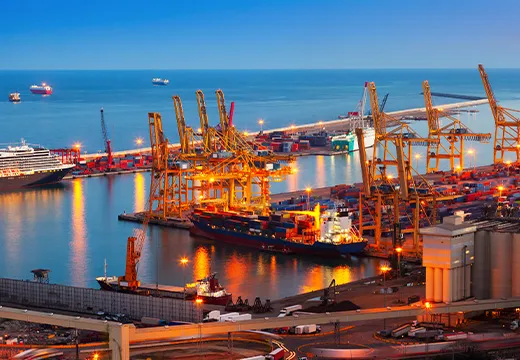 Containers stacked at a busy shipping port
